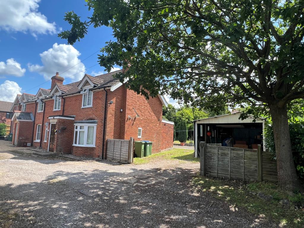 Lot: 128 - THREE-BEDROOM COTTAGE FOR IMPROVEMENT ON FIFTH OF AN ACRE PLOT WITH POTENTIAL - External show showing property with land to side